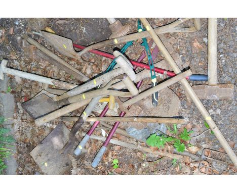 A COLLECTION OF GARDEN TOOLS comprising spades, fork, pick axe etc (10+)