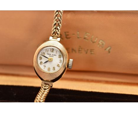 A 1960'S 9CT GOLD FAVRE-LEUBA WRISTWATCH, the white face with Arabic numerals, engine turned surround and herringbone design 
