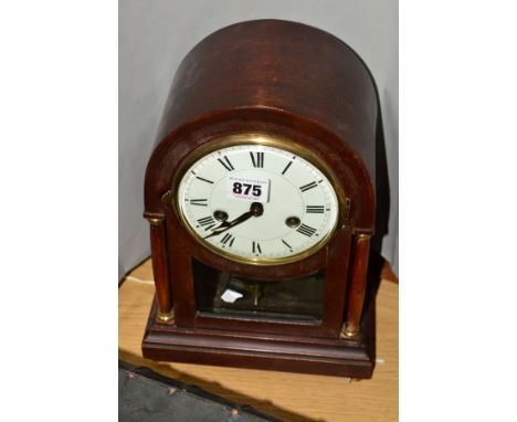 A MAHOGANY CASED BRACKET CLOCK BY GUSTAV BECKER, white porcelain face with Roman numerals, side pillars, brass fittings, arch
