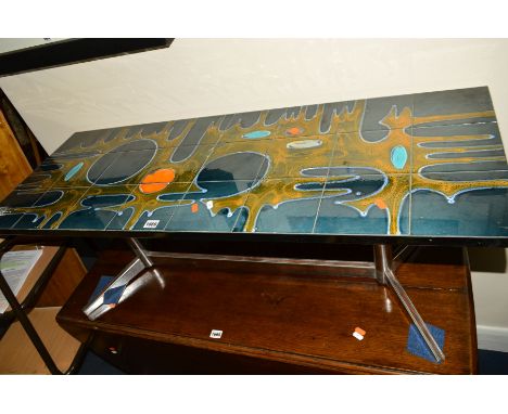 A 1970'S RECTANGULAR TILE TOP AND CHROME COFFEE TABLE, the twenty four tiles decorated with abstract design in blues and oran