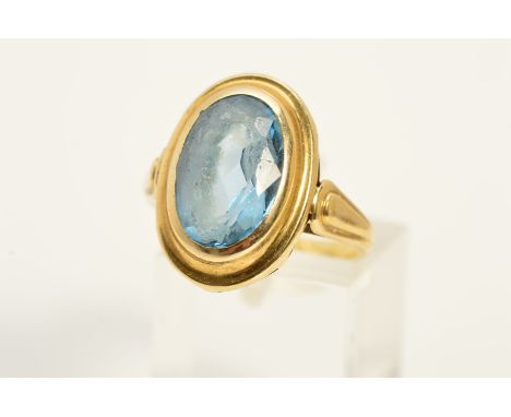 A LATE 20TH CENTURY LARGE SINGLE STONE BLUE TOPAZ RING, an oval mixed cut blue topaz measuring 14mm x 10mm, ring size P, appr