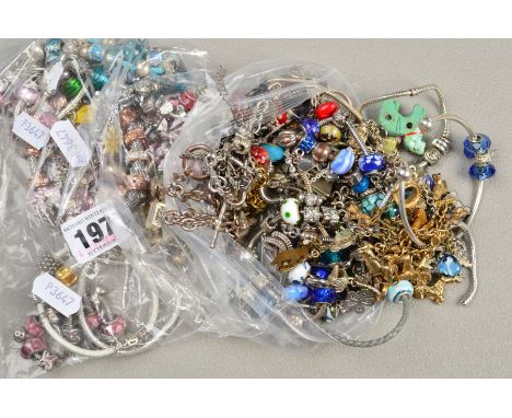 A SELECTION OF CHARMS AND CHARM BRACELETS, to include glass and enamel charms, many bracelets and charms believed to be base 