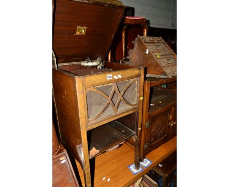 A DISTRESSED HIS MASTERS VOICE MAHOGANY WIND UP GRAMOPHONE, with records, together with an oak tea trolley, carved oak corner