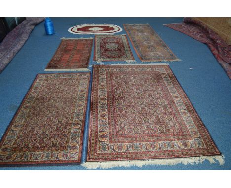 A 20TH CENTURY BOKARA STYLE RUSSET GROUND CARPET RUNNER, 226cm x 69cm, together with two similar Farahan style rugs and three
