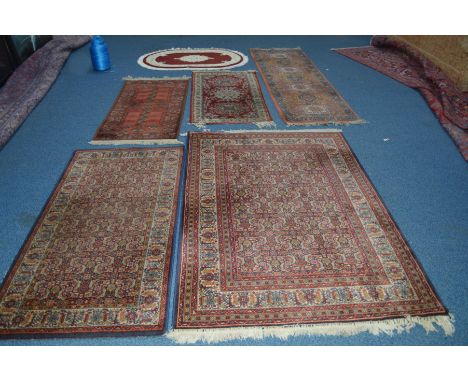 A 20TH CENTURY BOKARA STYLE RUSSET GROUND CARPET RUNNER, 226cm x 69cm, together with two similar Farahan style rugs and three