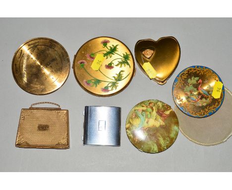 SEVEN MID 20TH CENTURY COMPACTS, to include a hangbag shaped compact by Mascot, a heart shape compact, an engine turned squar