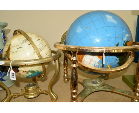 A MODERN TABLE TOP GEMSTONE EFFECT GLOBE, in brass gimbal, compass mounted between the legs, approximate height 33cm and anot