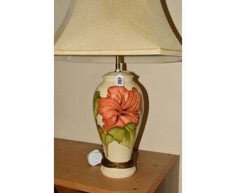 A MOORCROFT POTTERY TABLE LAMP AND SHADE, 'Hibiscus' pattern on cream ground, impressed and painted marks to base, height app