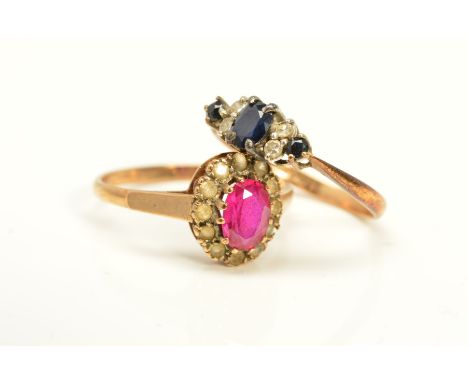 TWO GEM RINGS, the first a cluster ring designed as an oval ruby within a circular colourless gem surround, assessed as rock 