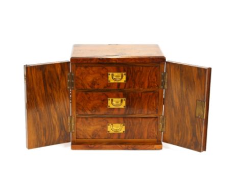 A Victorian walnut and inlaid trinket cabinet, fitted three drawers