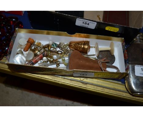 A tray of mother of pearl and other sewing items 