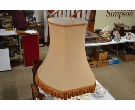 A turned wooden standard lamp and shade 