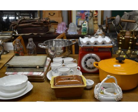 A collection of various kitchenware to include a Le Creuset pot and cover, stainless steel items, kitchen scales etc. 