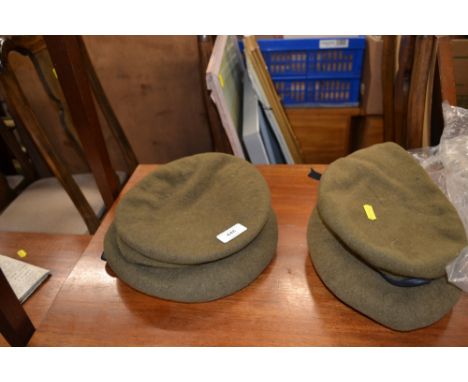 Eight British Army hats