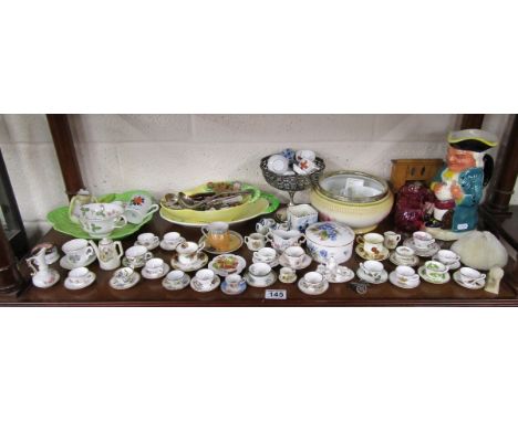 Shelf of ceramics to include miniature tea cups, musical Toby jug etc