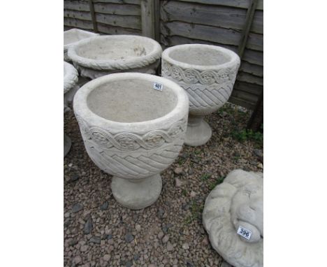 Pair of stone Mayan Urns - circular planters decorated with Aztec designs on circular bases