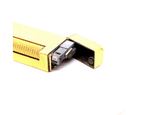 A DUNHILL GOLD PLATED ROLLAGAS CIGARETTE LIGHTER