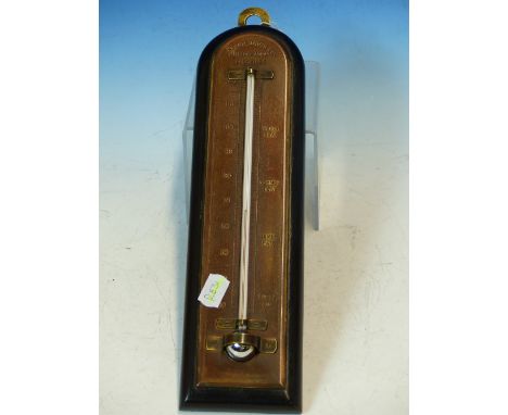 A VINTAGE HANGING WALL THERMOMETER BY JOSEPH DAVIES AND CO. FITZROY WORKS, LONDON  S.E.  EBONISED ARCHED MOUNT.  H. 34cms.