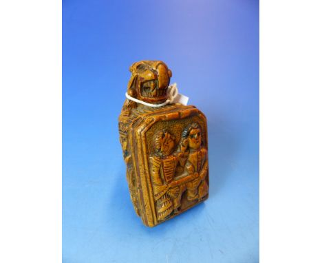 A CARVED WOOD SNUFF BOX, THE HINGED LID BACKED BY A LION. THE LID ITSELF CARVED IN RELIEF WITH A COUPLE SEATED AT A TABLE SHE