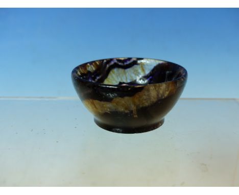 A SMALL BLUE JOHN POLISHED BOWL, A STRIATED STONE KNIFE HANDLE, A WHITE JADE PENDANT, A GREEN JADE CABUCHON AND OTHER POLISHE