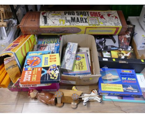 Three boxes of vintage children's toys, games, books and a Pro Shot Golf by Marx