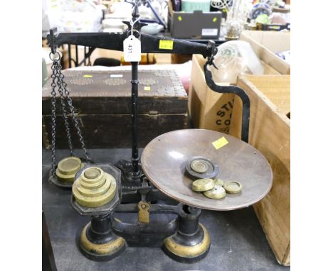 Two sets of black metal antique weighing scales