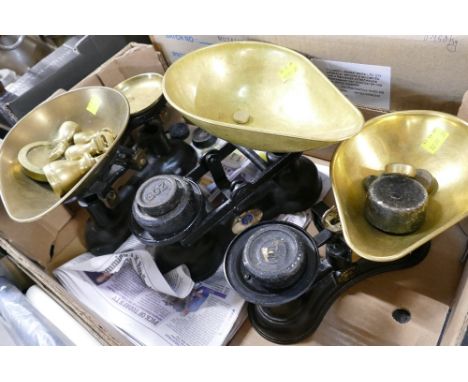 Thee sets of black metal and brass weighing scales