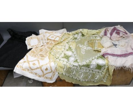 Black netted mourning shawl, 2 intricate hand embroidered table cloth sets with matching napkins, wool hand embroidered paisl