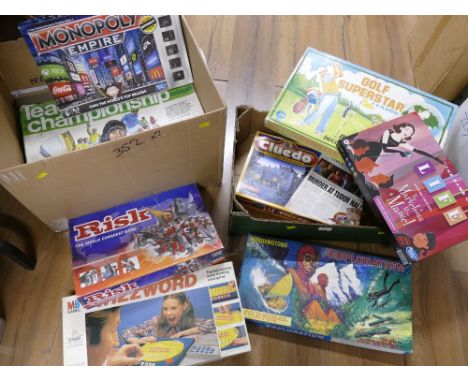 Two boxes of vintage children's board games - Waddingtons Exploration, Wizzword, Monopoly Empire and Risk