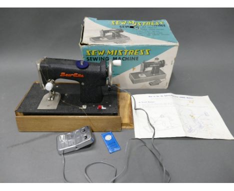 Boxed vintage child's Sew-Mistress / Sew-Ette sewing battery operated machine.
