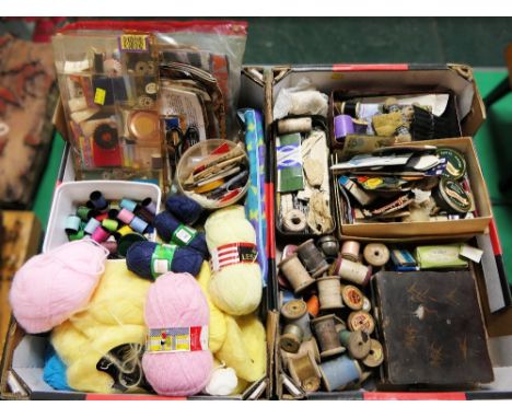 Two boxes of vintage sewing accessories including wooden cotton reels, tins of  pins, wool, scissors etc