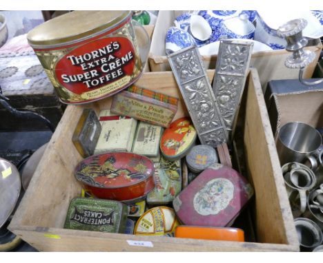 Wooden crate containing vintage tins