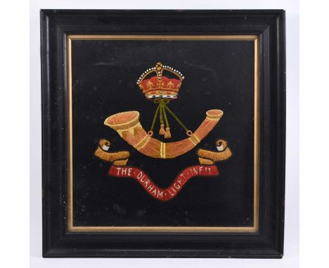 A Durham Light Infantry wool tapestry, the with the Light Infantry bugle above regimental scroll, framed, 53 x 53.5cm overall