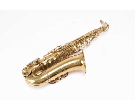 A Revelle Italian saxophoneTogether with two cases, stand and accessories.Condition:Playable condition.  Some very minor reco