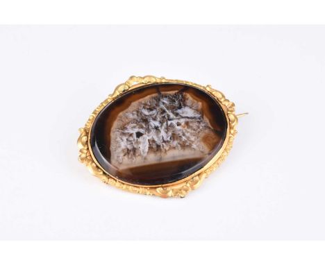 A late 19th century oval hardstone brooch, within yellow metal decorative mount, 62mm wide
 
A cultured pearl set spray brooc