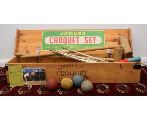 A Jacques London croquet set, with four mallets, five balls, eight hoops, one centre peg and four smaller pegs as well as the