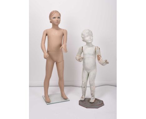 Two 20th century mannequins of boys,One composite mannequin on a square glass stand, articulated at the left hip, waist, wris