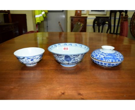 Three Oriental blue and white bowls, comprising: a Chinese dragon bowl, Kangxi four character mark, 12cm diameter, (s.d.); a 
