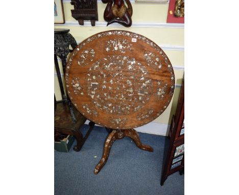 A 19th century Anglo-Chinese teak and mother of pearl inlaid circular tilt-top tripod table, with bird cage action, 90cm diam