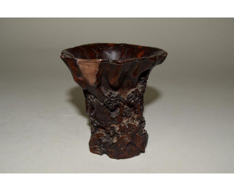 A Chinese carved wood libation cup, probably 17th/18th century, carved in relief with buildings in a continuous landscape, 9.
