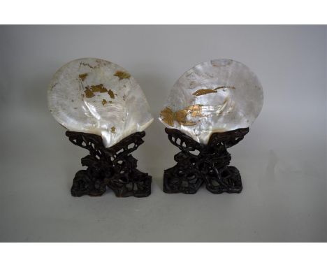 A pair of Chinese mother of pearl table screens and carved wood stands, 19th century, total height 31cm high, (severe wear to