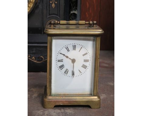 BRASS AND GLASS CASED FRENCH STYLE BRACKET CLOCK