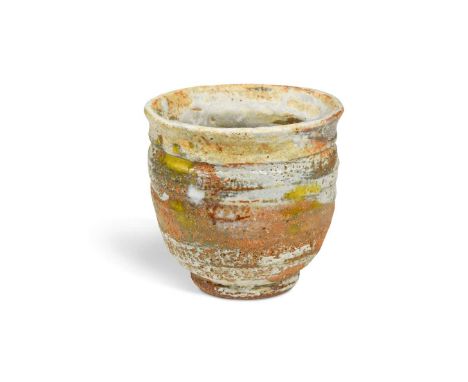 § Robin Welch (British, 1936-2019), a small stoneware footed bowl, partially glazed in off-white and splashed with yellow ena