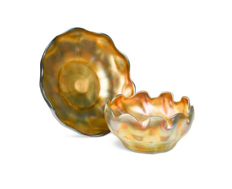A Tiffany Favrile glass finger bowl and stand, each with scalloped rims and etched L.C.T. marks to undersidethe stand 16cm di
