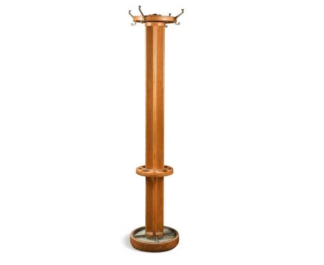 An Art Deco oak coat stand, the cruciform column with revolving top mounted with brass hooks, the stick stand base with remov