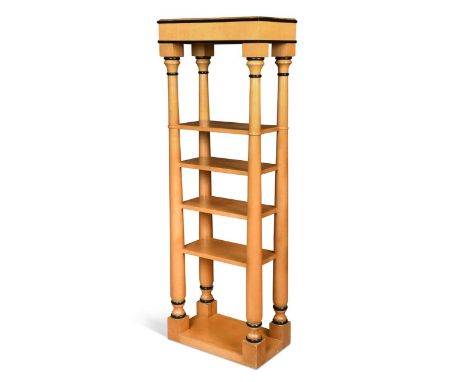 A free-standing architectural shelving unit in the Biedermeier style, the four central shelves united by columnar supports an