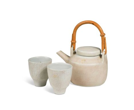 § David Leach OBE (British, 1911-2005), a Lowerdown pottery teapot and two tea bowls, each decorated with a pink stained crac