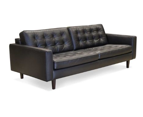 Paola Navone for Contempo, a black leather Urano four-seat sofa, with button studded seat and back cushions raised on dark st