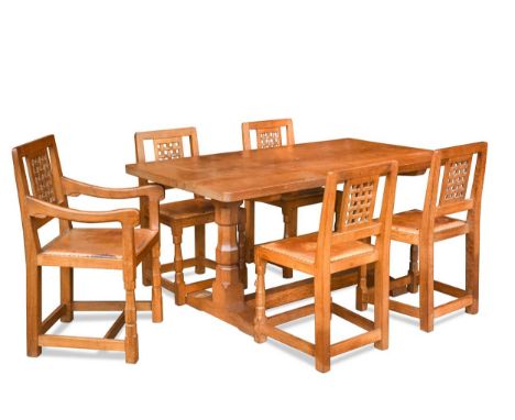 Robert 'Mouseman' Thompson, an oak dining table and five chairs, the adzed rectangular table on octagonal column supports and