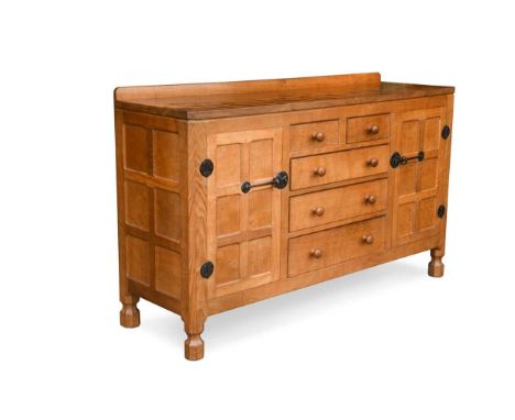 Robert 'Mouseman' Thompson, an oak sideboard, the adzed rectangular top above five central drawers and cupboards to either si